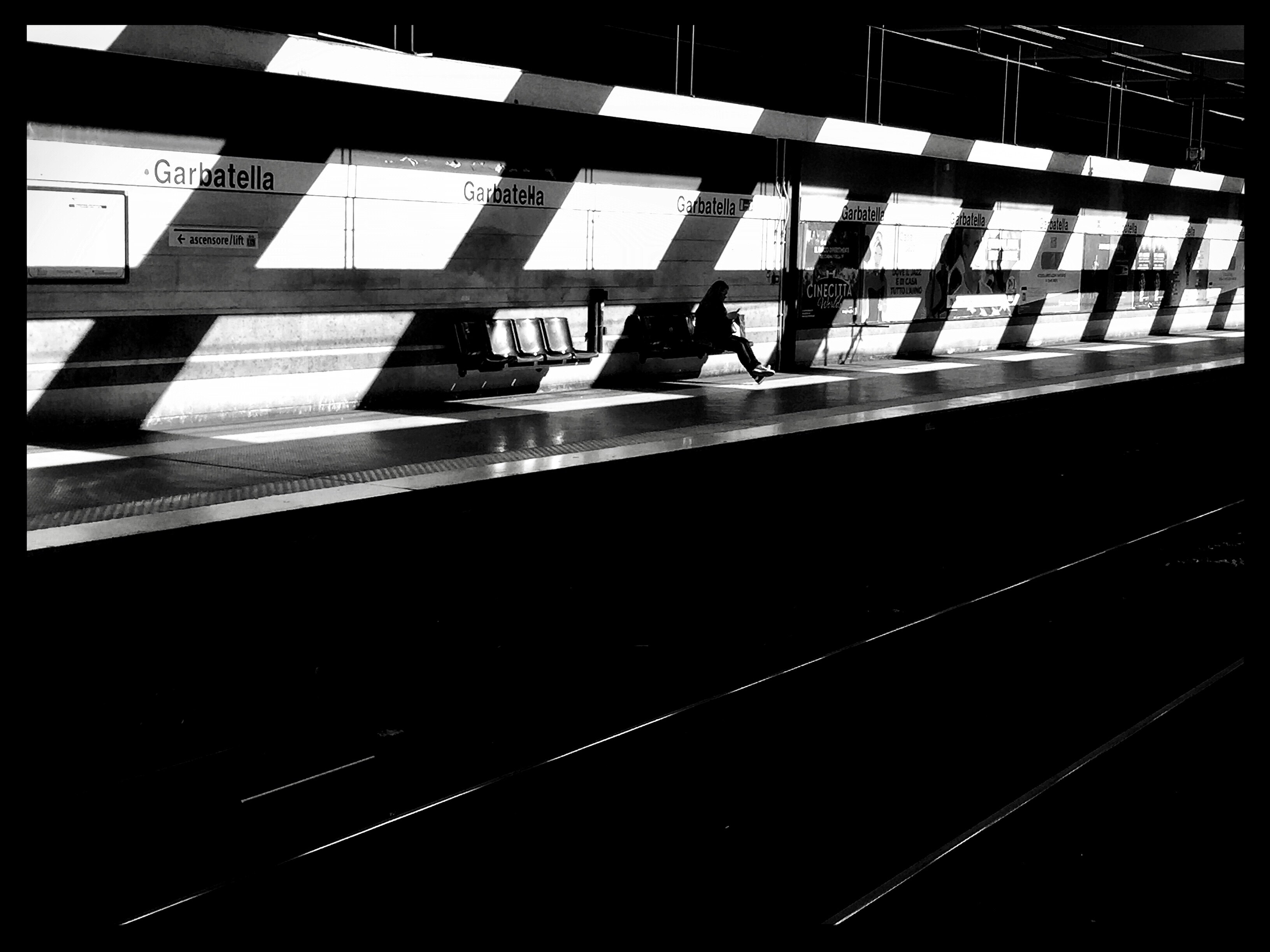 person sitting in subway